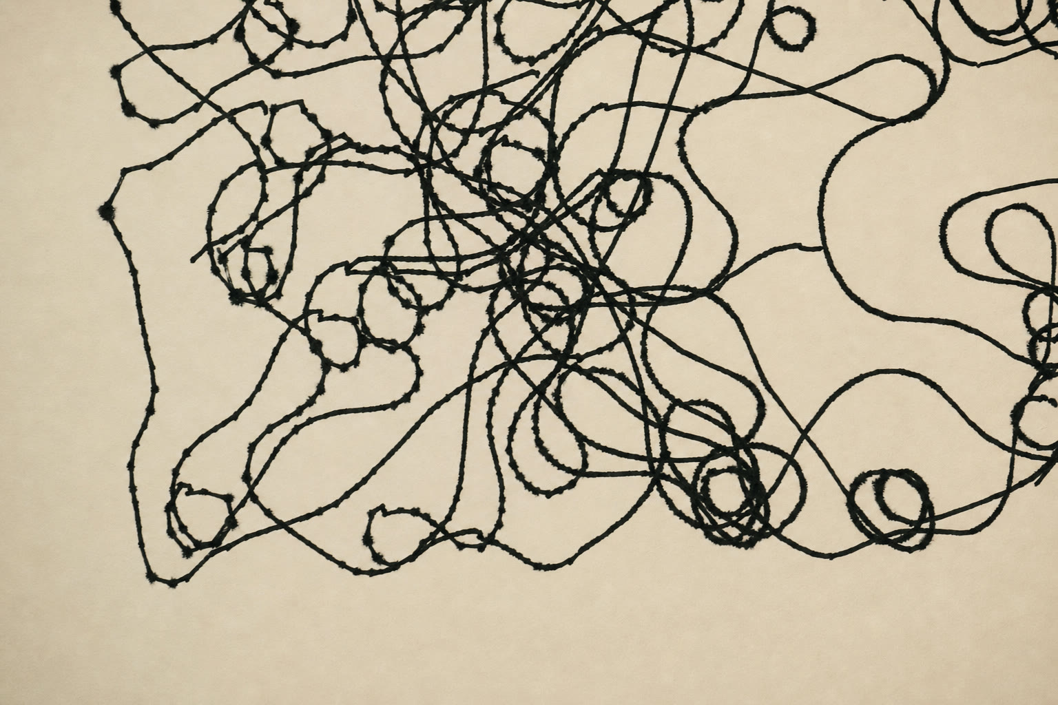 Single continuous scribbled line drawing